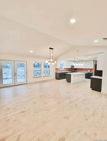 a view of kitchen with stainless steel appliances kitchen island