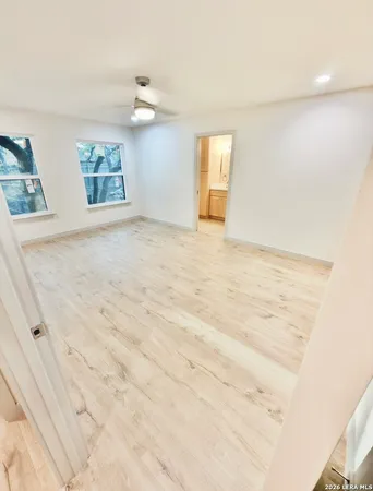 a view of empty room with windows