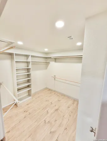 a view of an empty walk in closet