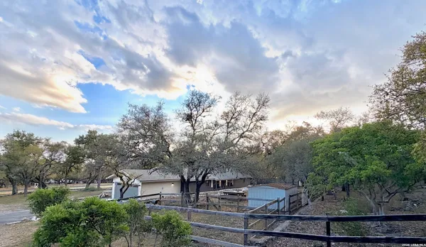 a view of house with trees in the background