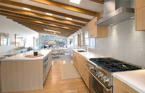 a kitchen with stove and cabinets