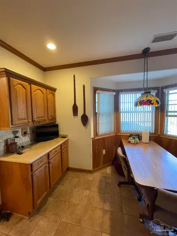 a living room with lots of furniture and a chandelier