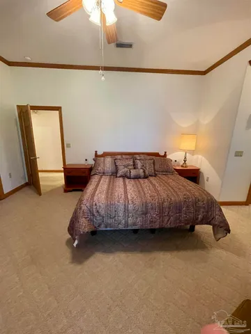a room with a black white checkered floor kitchen island a sink and a refrigerator