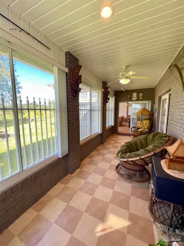 a view of a livingroom with furniture and a ceiling fan