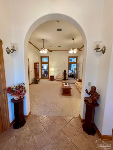 a dining room with furniture and chandelier