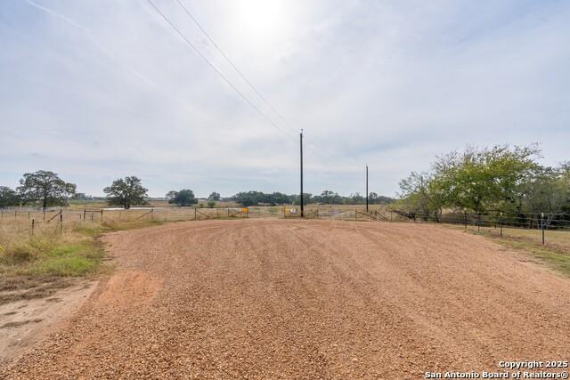 957 Johnson Farms Road Harwood, TX 78632 - Photo 5 of 15 View of dirt / gravel road with a view of rural / pastoral area