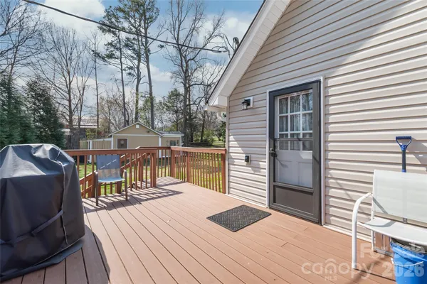 a view of a patio with wooden floor