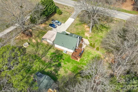an aerial view of a house with yard and outdoor space