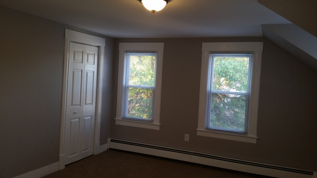 49 Drexel Street Springfield, MA 01104 - Photo 11 of 30 a view of an empty room with a window