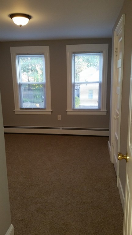 49 Drexel Street Springfield, MA 01104 - Photo 13 of 30 a view of a room that has a window in it