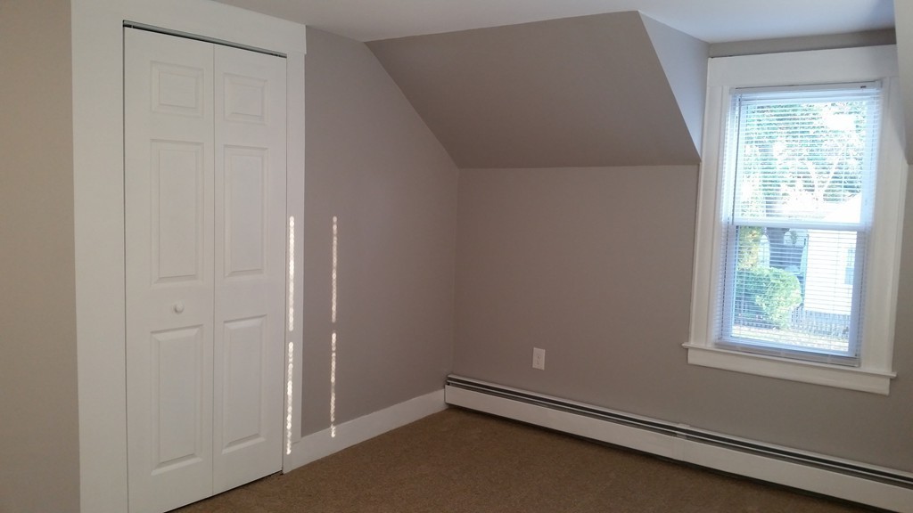 49 Drexel Street Springfield, MA 01104 - Photo 14 of 30 an empty room with windows