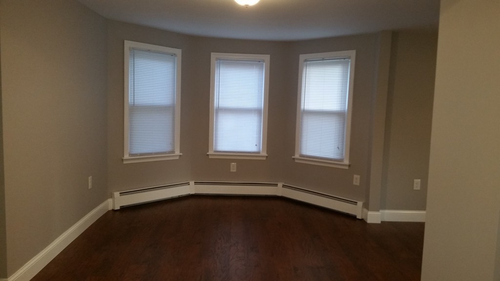 49 Drexel Street Springfield, MA 01104 - Photo 25 of 30 an empty room with a window