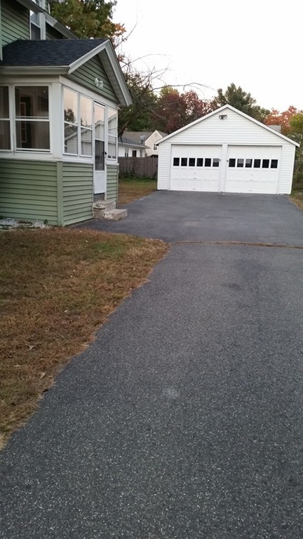 49 Drexel Street Springfield, MA 01104 - Photo 29 of 30 a view of a house with a yard and garage