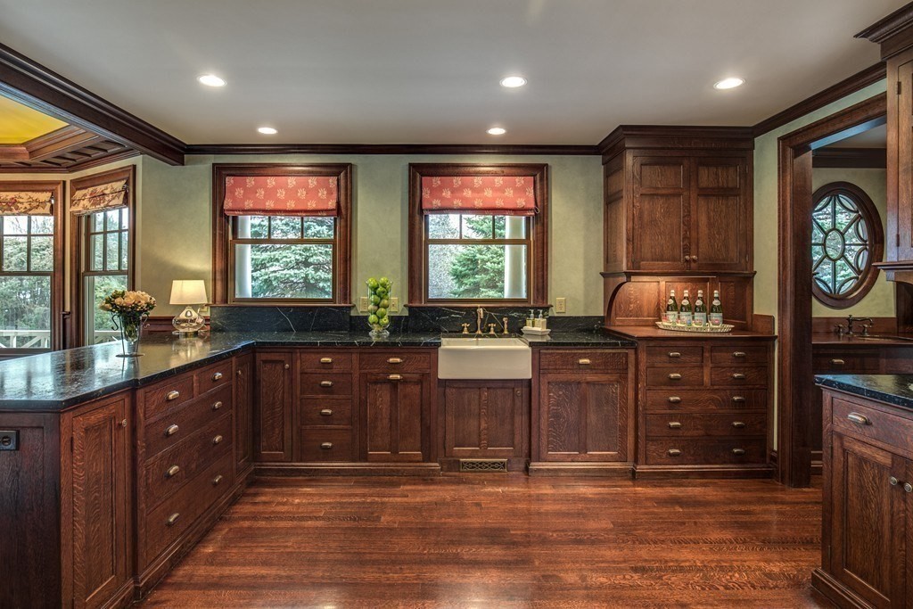 7 Percy Road Lexington, MA 02421 - Photo 15 of 29 a kitchen with a sink window and cabinets