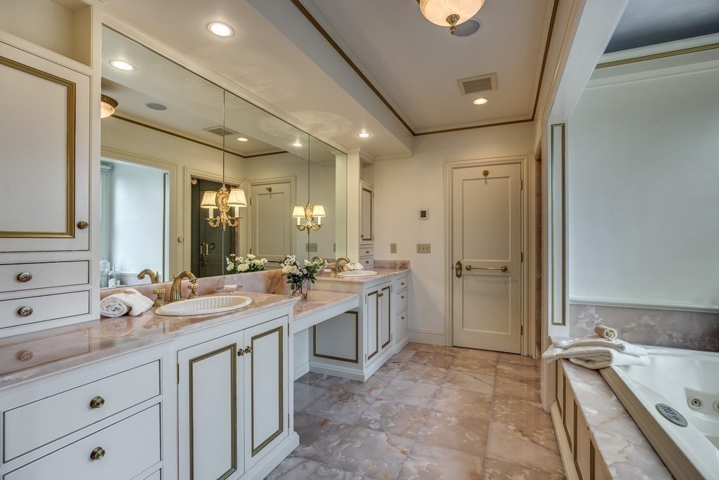 7 Percy Road Lexington, MA 02421 - Photo 26 of 29 a spacious bathroom with a granite countertop sink mirror and bathtub