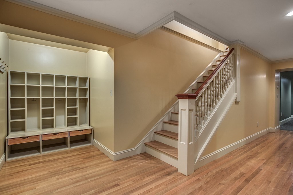 7 Percy Road Lexington, MA 02421 - Photo 28 of 29 a view of a room with wooden floor and stairs