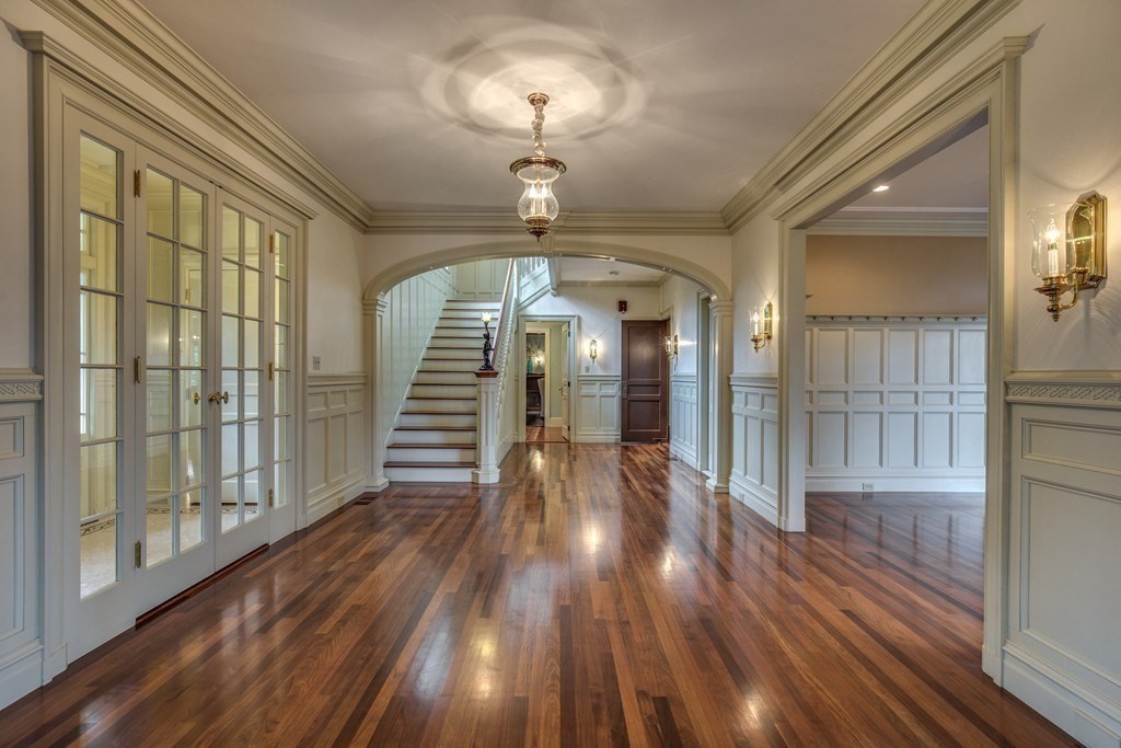 7 Percy Road Lexington, MA 02421 - Photo 7 of 29 a view of a room with wooden floor chandelier and entryway