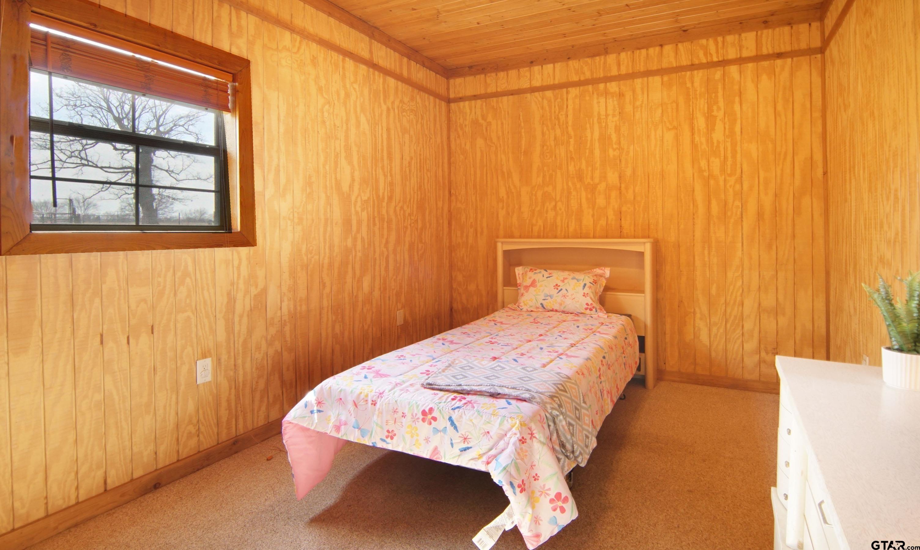 342 Rscr 3345 Emory, TX 75440 - Photo 24 of 31 a bedroom with a bed and a window