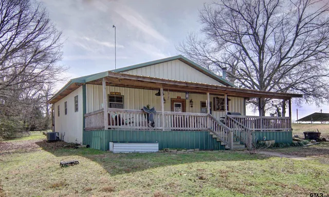 a room with a door and a mirror