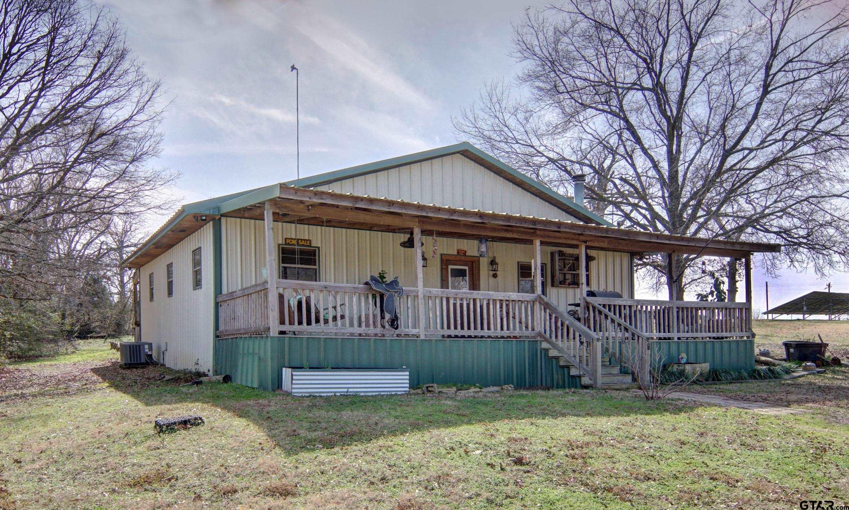 342 Rscr 3345 Emory, TX 75440 - Photo 4 of 31 a front view of a house with garden