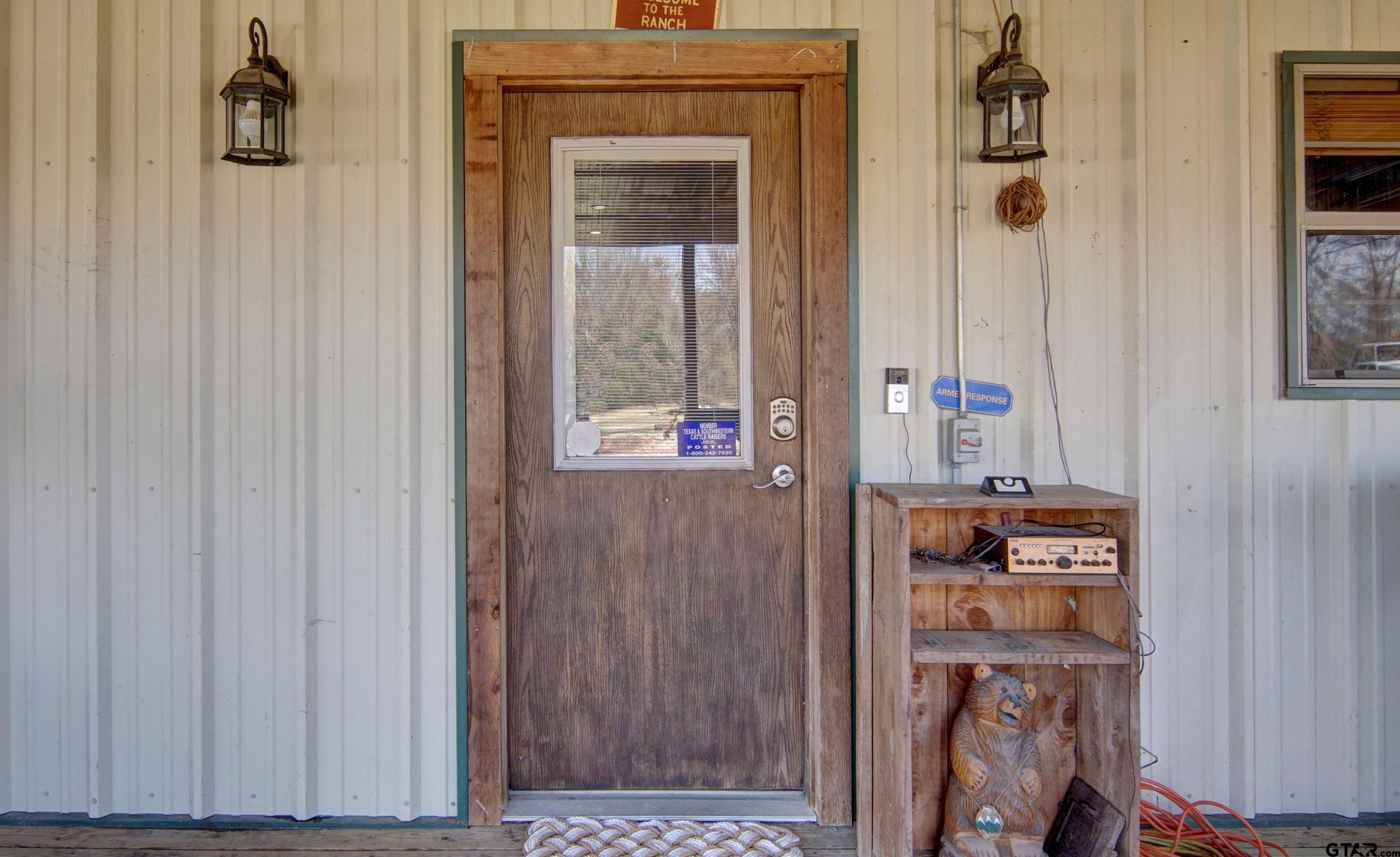 342 Rscr 3345 Emory, TX 75440 - Photo 6 of 31 a room with a door and a mirror
