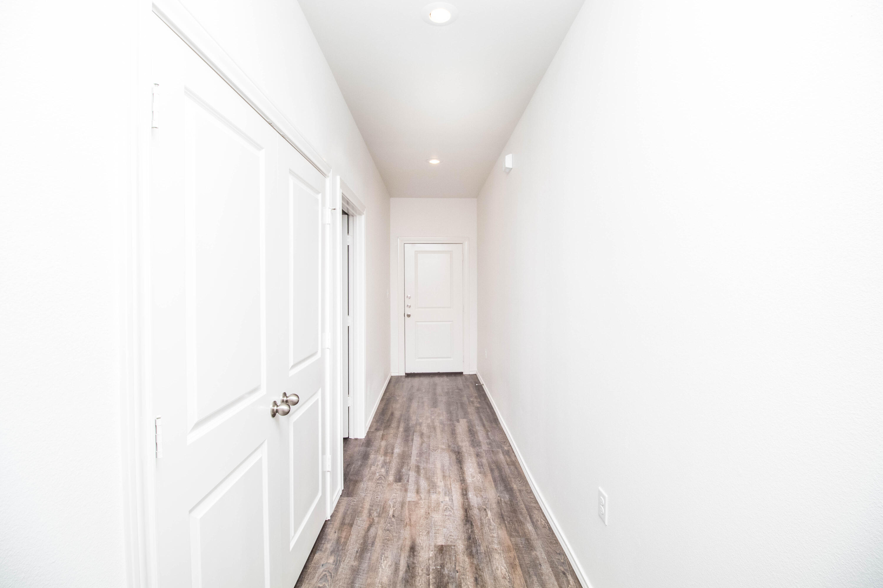 6914 21st Street Lubbock, TX 79407 - Photo 23 of 36 a view of a hallway with wooden floor