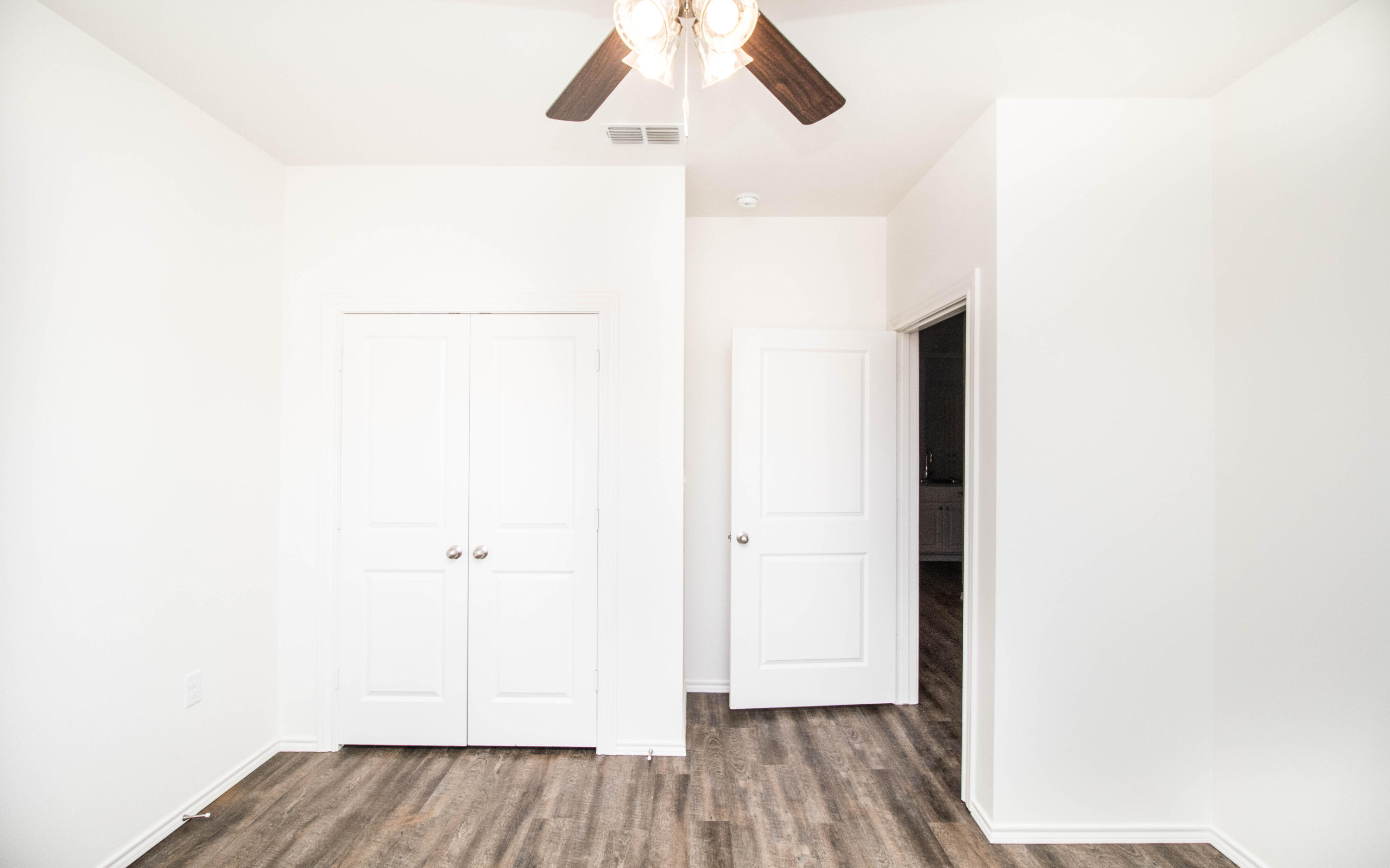 6914 21st Street Lubbock, TX 79407 - Photo 25 of 36 a view of a hallway with wooden floor