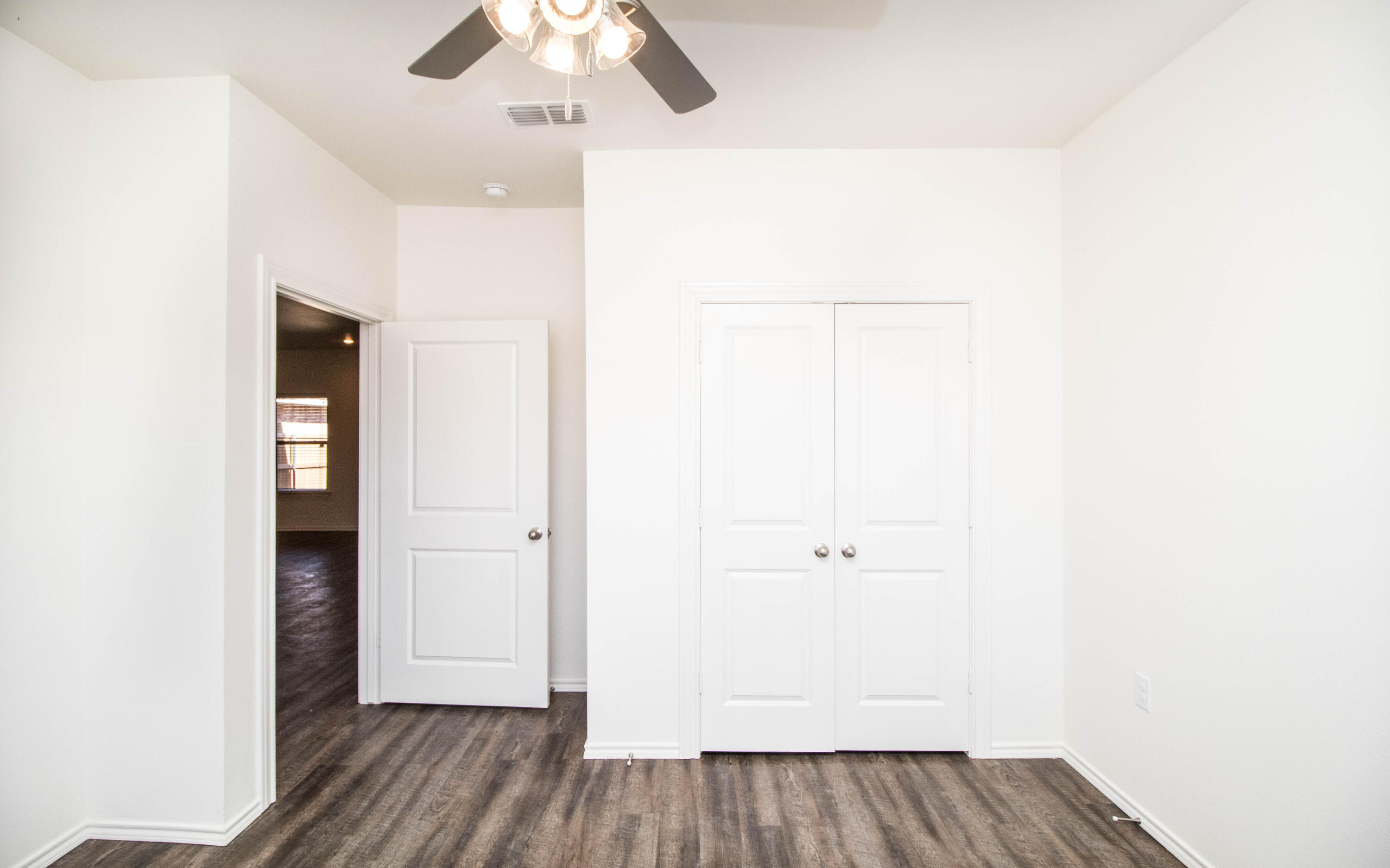 6914 21st Street Lubbock, TX 79407 - Photo 28 of 36 a view of a hallway with wooden floor