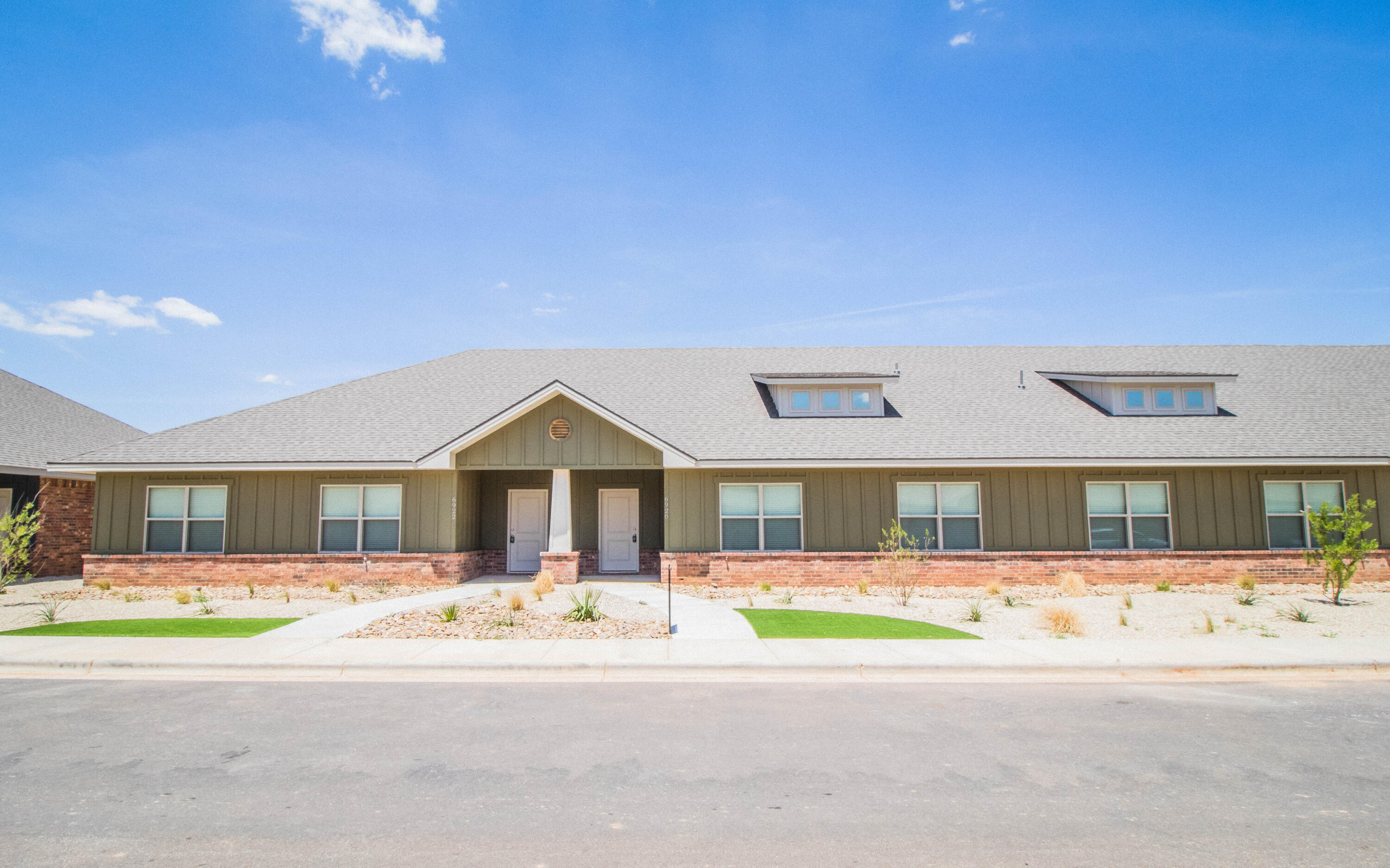 6914 21st Street Lubbock, TX 79407 - Photo 32 of 36 a front view of a house with a yard