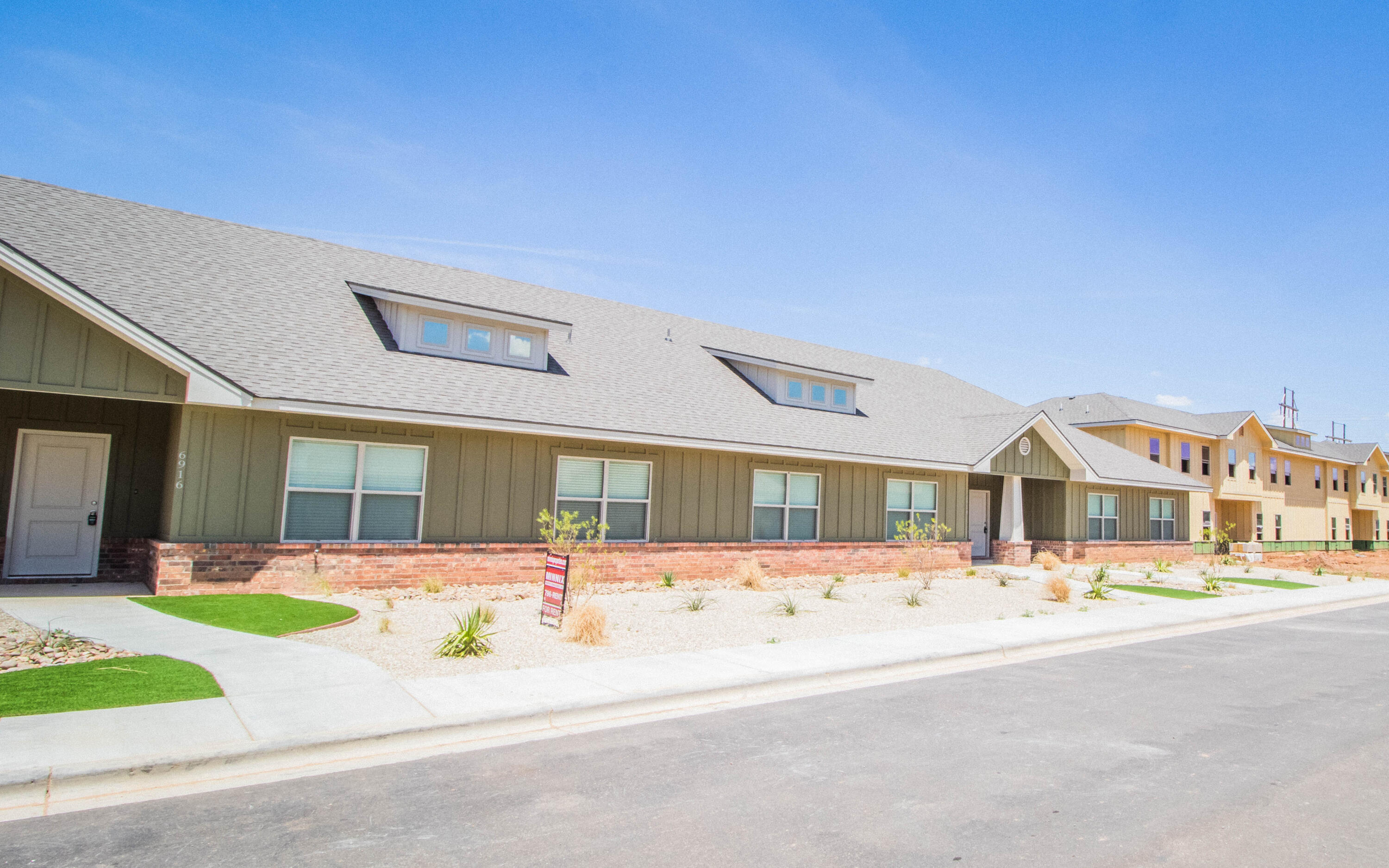 6914 21st Street Lubbock, TX 79407 - Photo 35 of 36 a front view of a building with street view