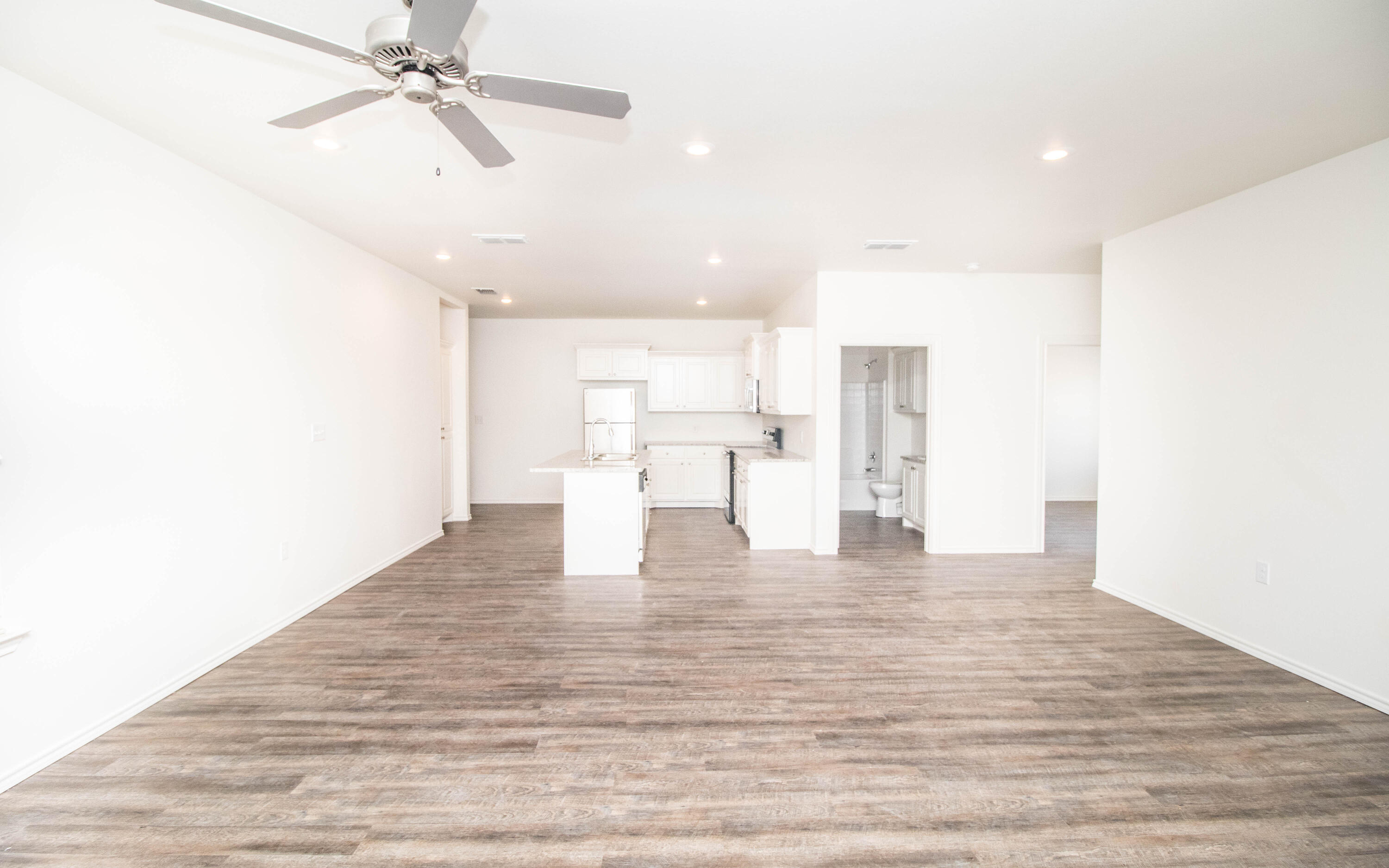 6914 21st Street Lubbock, TX 79407 - Photo 8 of 36 a view of a kitchen with wooden floor