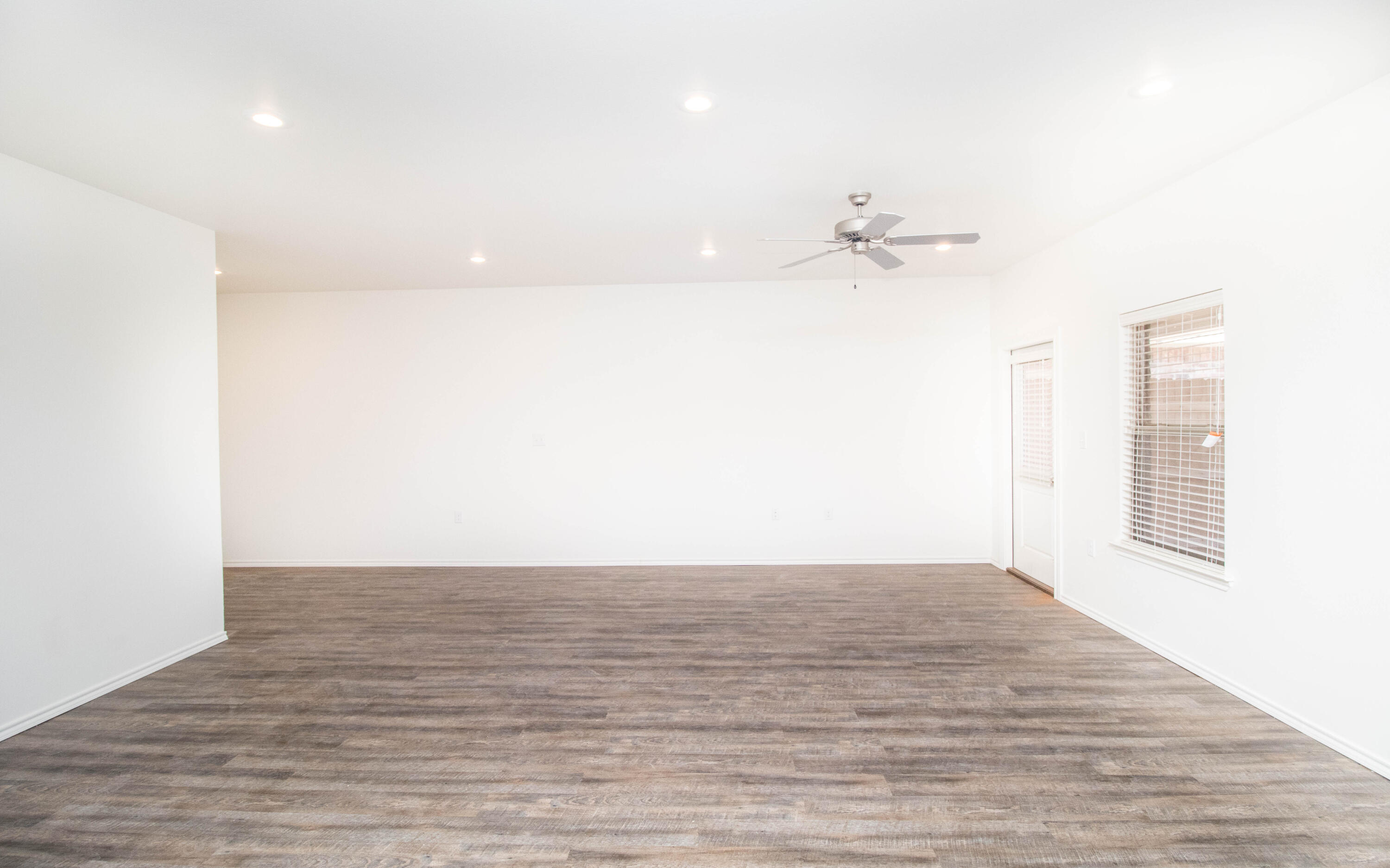 6914 21st Street Lubbock, TX 79407 - Photo 9 of 36 a view of an empty room with a window