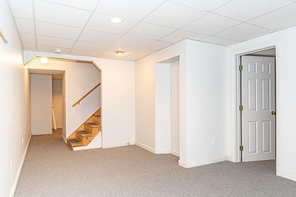 487 Boston Road Groton, MA 01450 - Photo 24 of 32 a view of an empty room with staircase