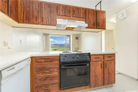 a kitchen with stainless steel appliances granite countertop a stove and a sink