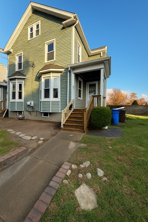 57 Colfax Street, Unit 57 Fall River, MA 02720 - Photo 1 of 7 a front view of a house with garden