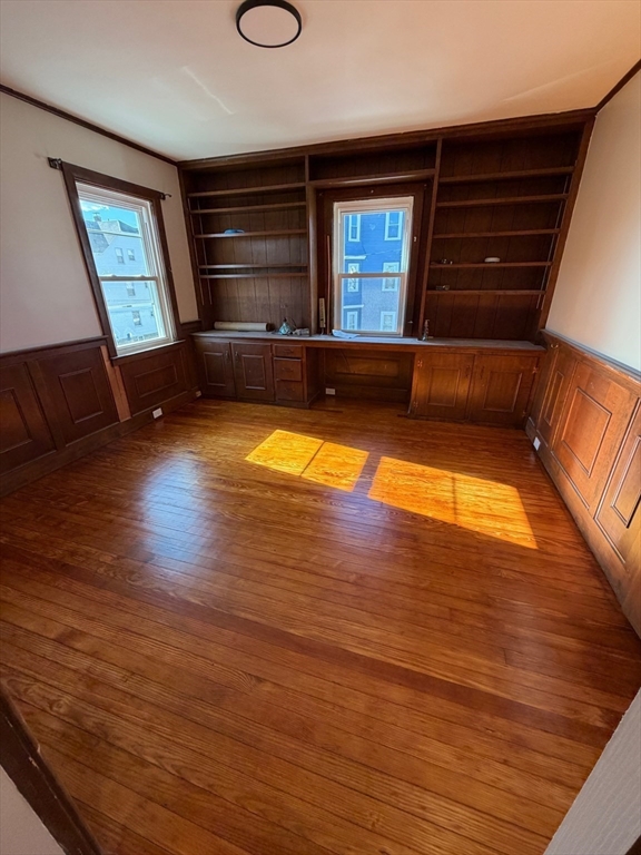 57 Colfax Street, Unit 57 Fall River, MA 02720 - Photo 7 of 7 a view of a room with wooden floor and staircase