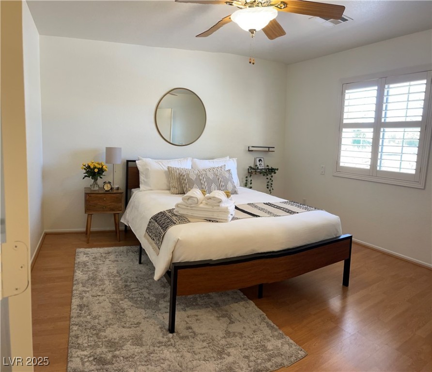 Undisclosed Address Las Vegas, NV 89118 - Photo 13 of 19 Bedroom with ceiling fan, baseboards, and wood fin