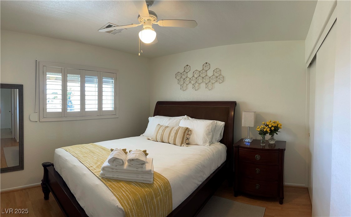 Undisclosed Address Las Vegas, NV 89118 - Photo 14 of 19 Bedroom featuring light wood-style floors and ceil