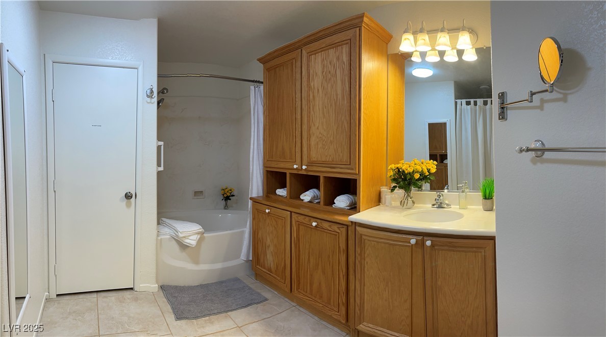 Undisclosed Address Las Vegas, NV 89118 - Photo 15 of 19 Full bath featuring tile patterned flooring, vanit