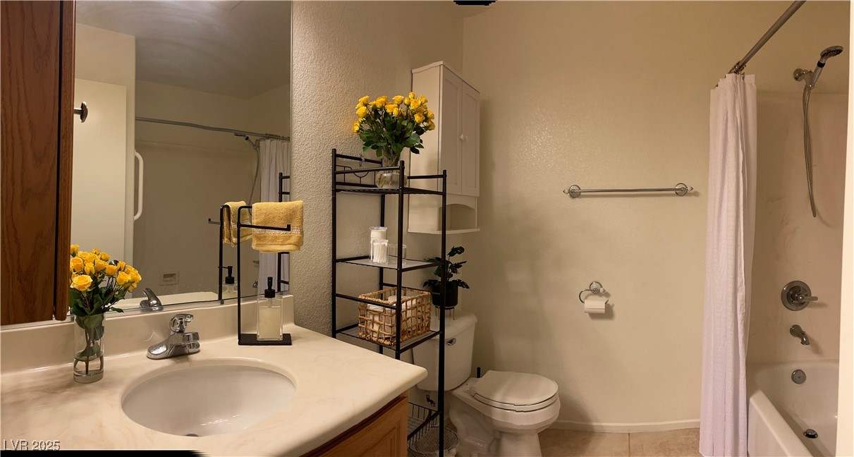 Undisclosed Address Las Vegas, NV 89118 - Photo 16 of 19 Bathroom featuring tile patterned flooring, toilet