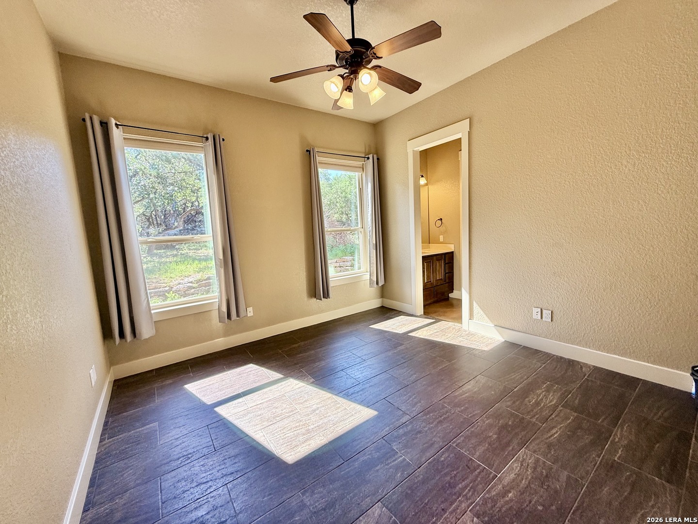 757 Copper Rim Spring Branch, TX 78070 - Photo 27 of 50 a view of an empty room with a window and wooden floor