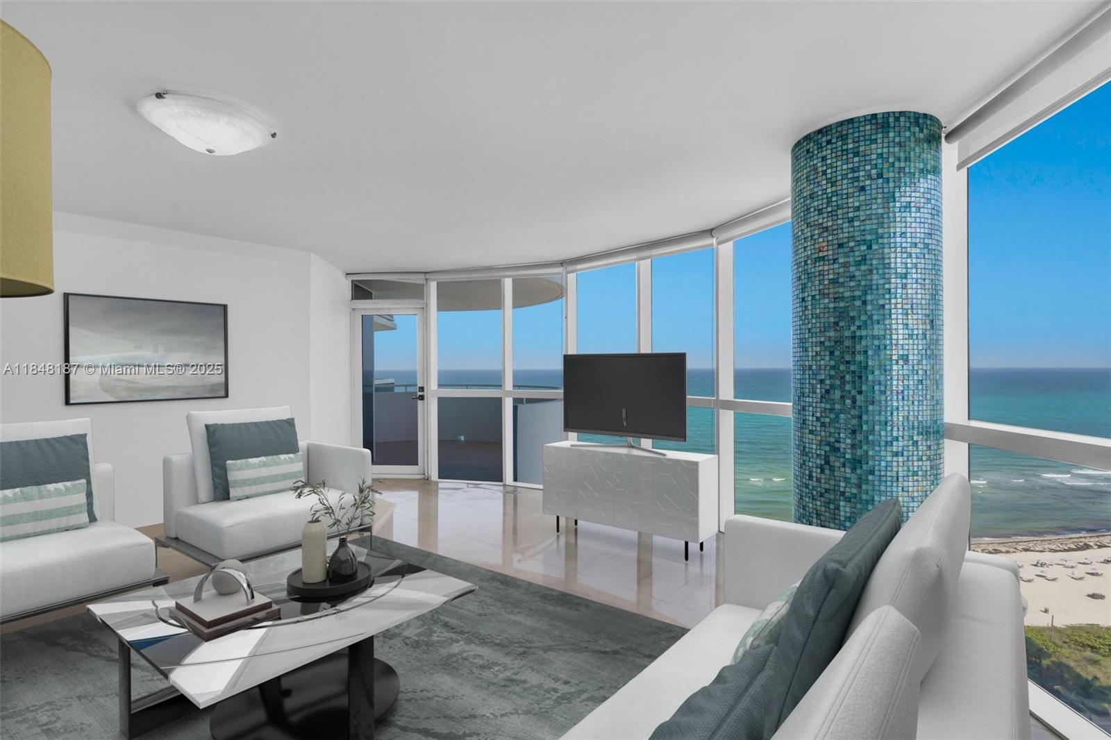 6301 Collins Avenue, Unit 1903 Miami Beach, FL 33141 - Photo 12 of 45 a living room with furniture a rug and a flat screen tv