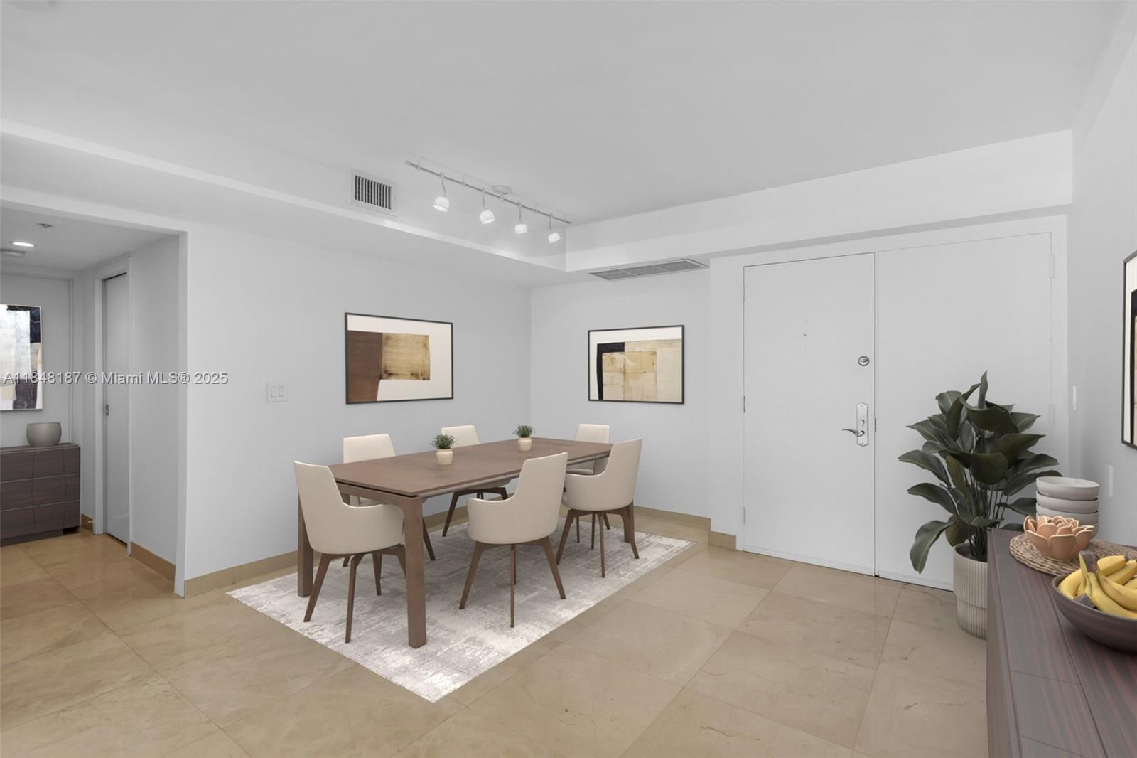 6301 Collins Avenue, Unit 1903 Miami Beach, FL 33141 - Photo 14 of 45 a view of a livingroom with furniture and a potted plant