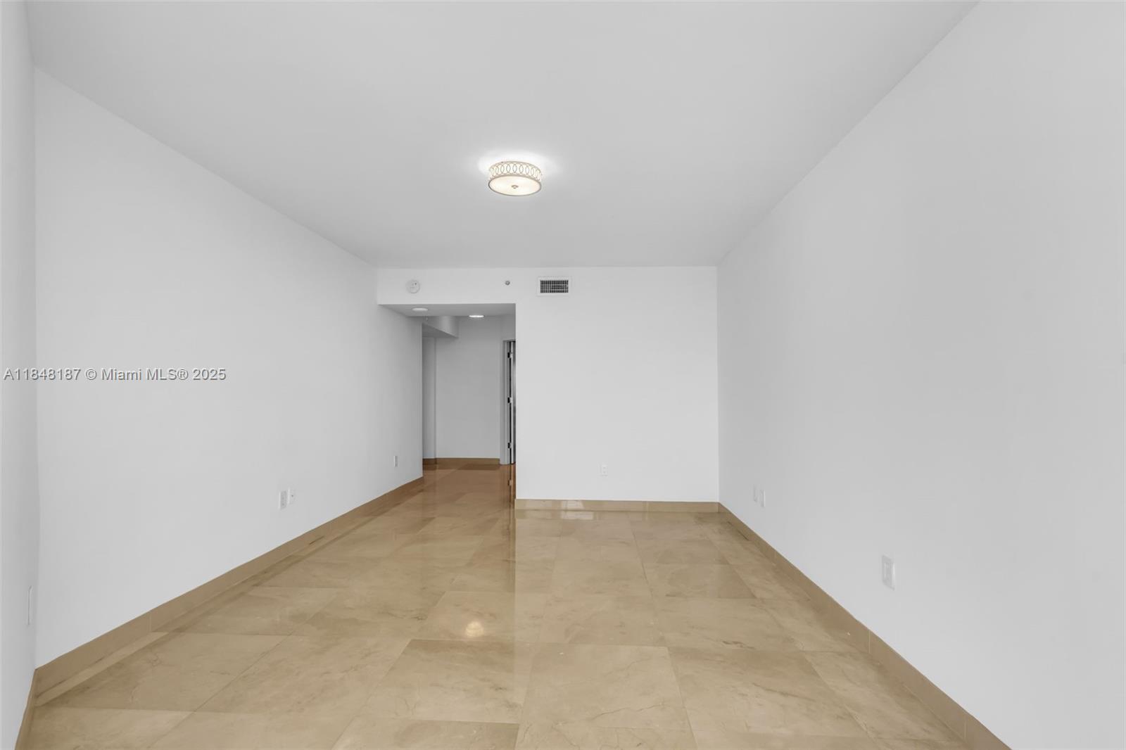 6301 Collins Avenue, Unit 1903 Miami Beach, FL 33141 - Photo 18 of 45 an empty room with an entryway