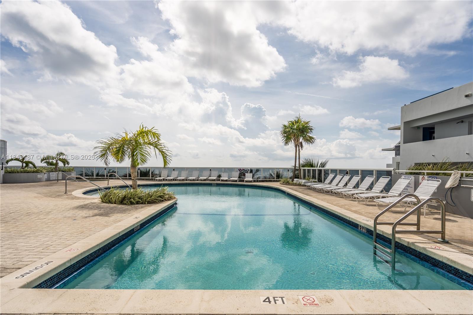 6301 Collins Avenue, Unit 1903 Miami Beach, FL 33141 - Photo 42 of 45 a view of swimming pool with seating space