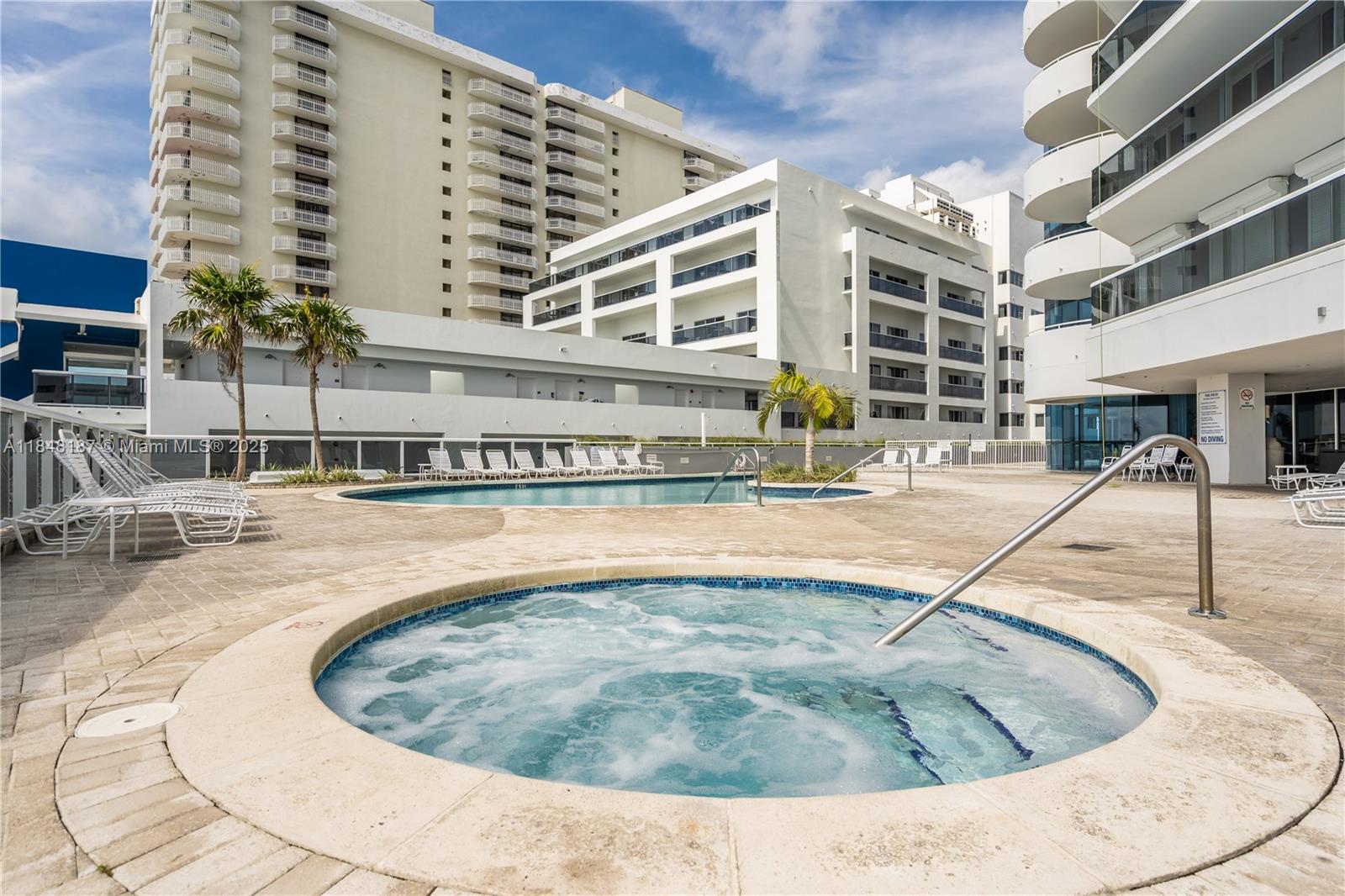 6301 Collins Avenue, Unit 1903 Miami Beach, FL 33141 - Photo 44 of 45 a view of a swimming pool with outdoor seating