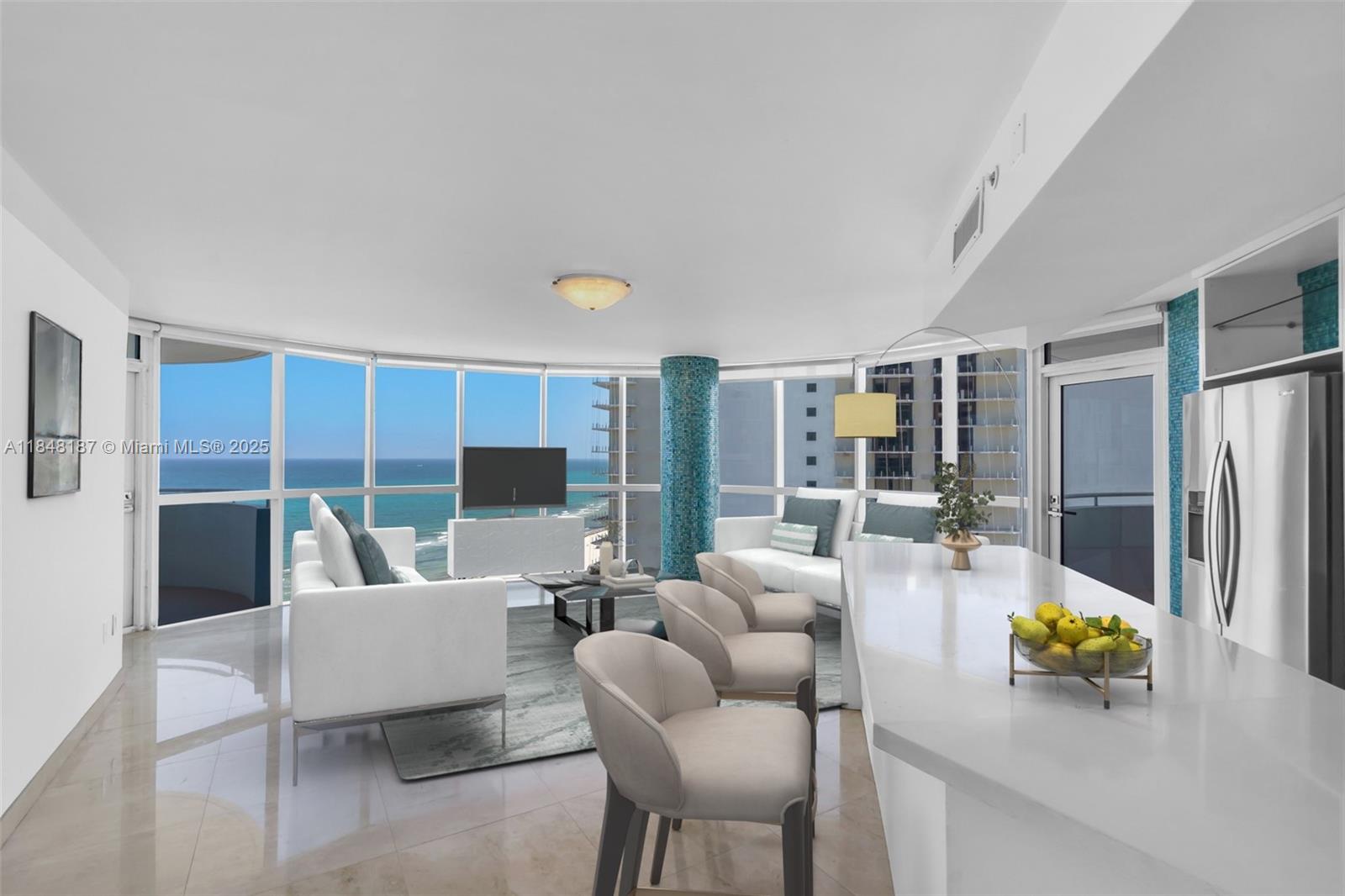 6301 Collins Avenue, Unit 1903 Miami Beach, FL 33141 - Photo 8 of 45 a living room with furniture and a table