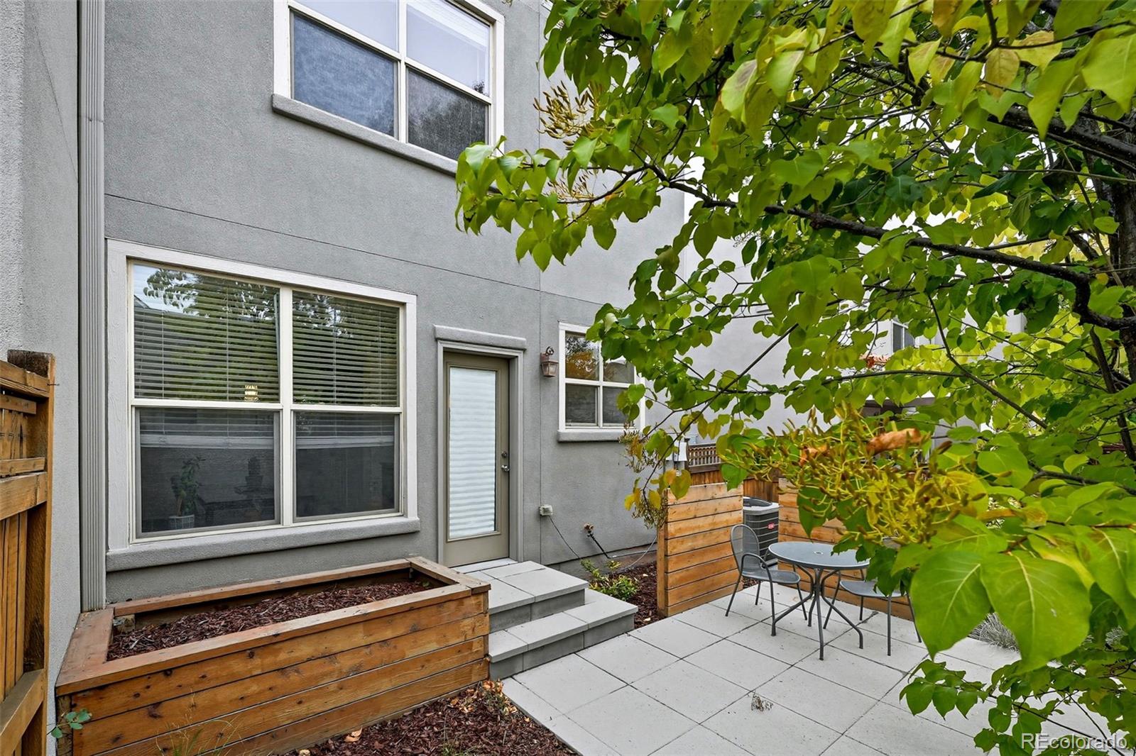 2826 Syracuse Court Denver, CO 80238 - Photo 22 of 35 a backyard of a house with table and chairs