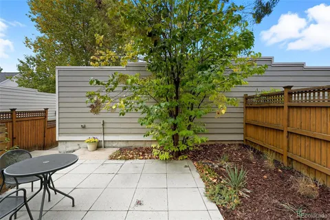 a view of a backyard with sitting area