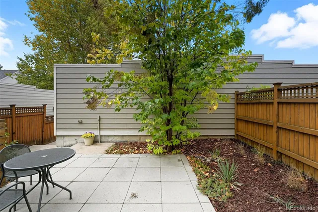 a view of a backyard with sitting area
